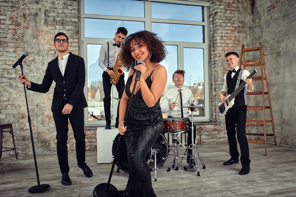 Young,International,Musicians,,A,Band,Performing,On,The,Loft,Stage.